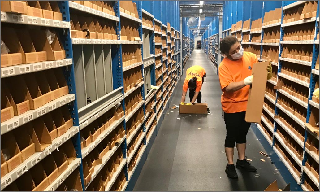 tidy employees cleaning items in warehouse